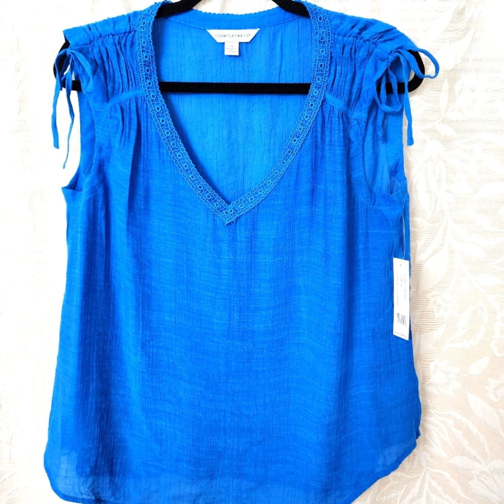 Counterparts ☆  Blue Smocked Tie Front Sleeveless Blouse. 62% Rayon 38% Poly
